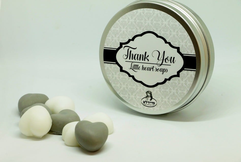 A box of heart-shaped soaps in a round metal tin - with love