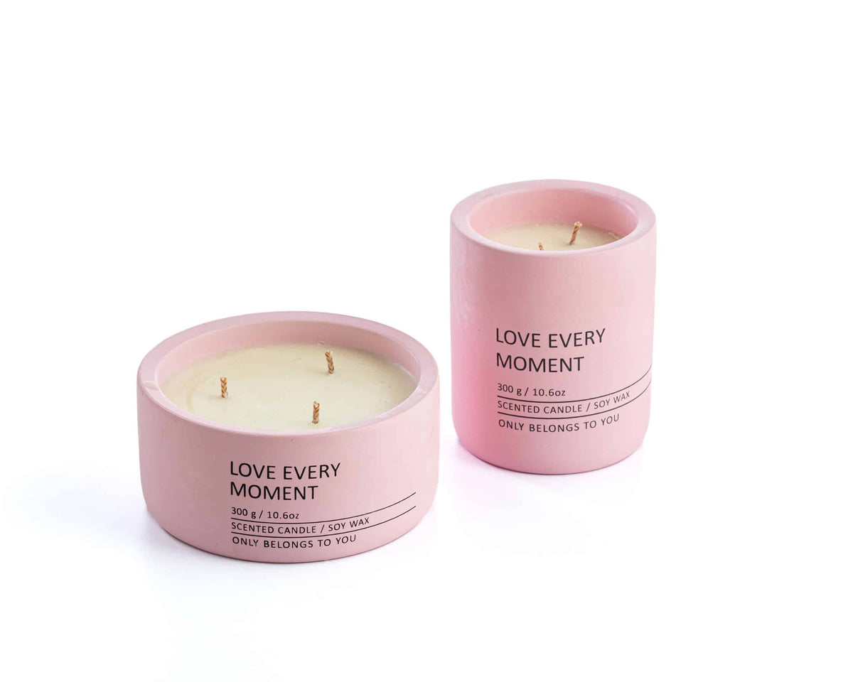 Natural soy candle in a pink ceramic container